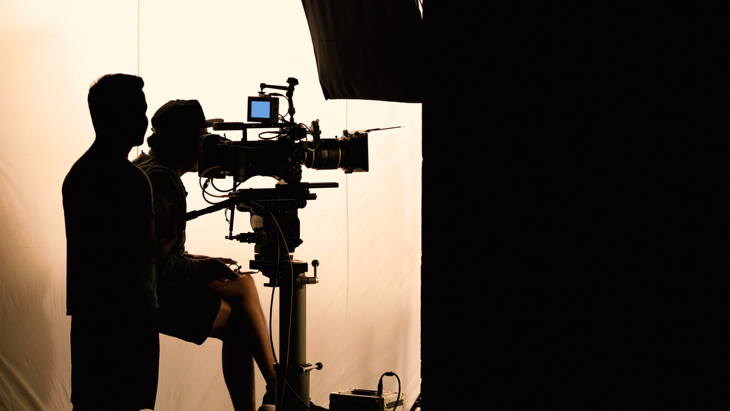 Silhouette of Camera Operators  in a Film Set 